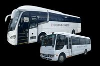 A bus and a van both with EV Tours & Charter signage.